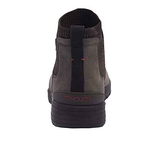 A rear view of the mens Hey Dude Scott Grip Boots shows a dark, casual design with a black pull tab, red stitching accents, and the brand name on the heel. The thick, black sole features an ultra grip outsole for added traction.