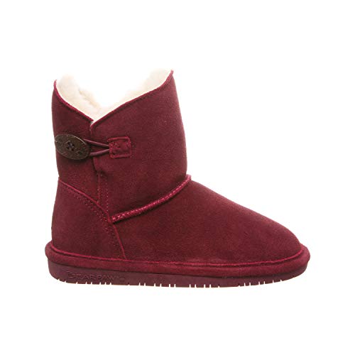 A single BEARPAW Rosie Youth Boot in maroon suede with a soft cream lining, side button detail, sheepskin footbed, and flat rubber sole is shown in side profile on a white background.