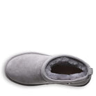 A top view of BEARPAW Shorty Boots for women in gray suede with plush lining, rounded toe, and low ankle design, shown against a white background.