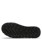 The rugged black sole of the BEARPAW Kendall Boots - Womens features deep grooves and a textured tread, designed for traction and grip on outdoor trails like those around Lake Tahoe.