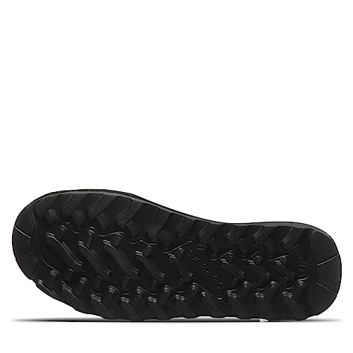The rugged black sole of the BEARPAW Kendall Boots - Womens features deep grooves and a textured tread, designed for traction and grip on outdoor trails like those around Lake Tahoe.