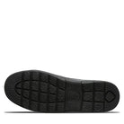 The black sole of BEARPAW Harry Slippers - Mens shows a grid-like tread pattern with textured toe and heel, viewed from below on a white background—ideal for cozy slipper collections.