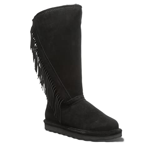 The BEARPAW Tamara Boots for women are black suede knee-high boots with a flat sole and fringe detailing on the outer side.