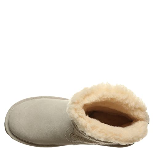 A top-down view of BEARPAW Virginia Boots - Womens in beige sheepskin, showcasing NeverWet technology and a thick, fluffy light tan lining visible at the opening.