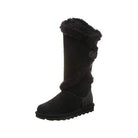 The BEARPAW Sheilah Boots for women are black suede winter boots with a flat sole, mid-calf height, black fur trim, rounded toe, and side button detail—combining style and coziness from a trusted brand.