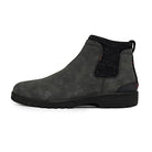Side view of the Hey Dude Scott Grip Boots - Mens in dark gray, featuring a black elastic side panel, black sole, heel pull tab, textured finish, slip-on style, and ultra grip outsole for reliable traction.