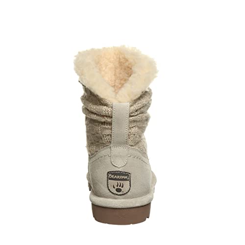 The BEARPAW Virginia Boots - Womens, shown from the back, feature a beige wool knit shaft, faux fur lining, flat brown sole, and heel logo patch. NeverWet technology provides water resistance.