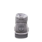 A back view of the BEARPAW Shorty Boots for women in gray suede, showing a logo patch with paw print on the heel and a pull tab at the collar.