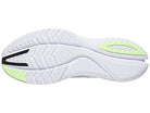 The image shows the white sole of the Saucony Freedom 4 Running Shoe - Mens, featuring grooved tread patterns with light green and black accents on the heel and toe.