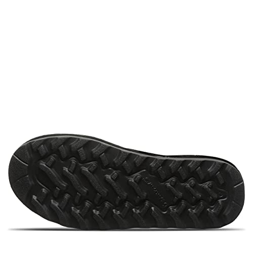 The image shows the black rubber sole of the BEARPAW Tamara Boots for women, featuring a rugged tread pattern for traction. The textured grip and rounded edges make these boots ideal for any adventurous outing.