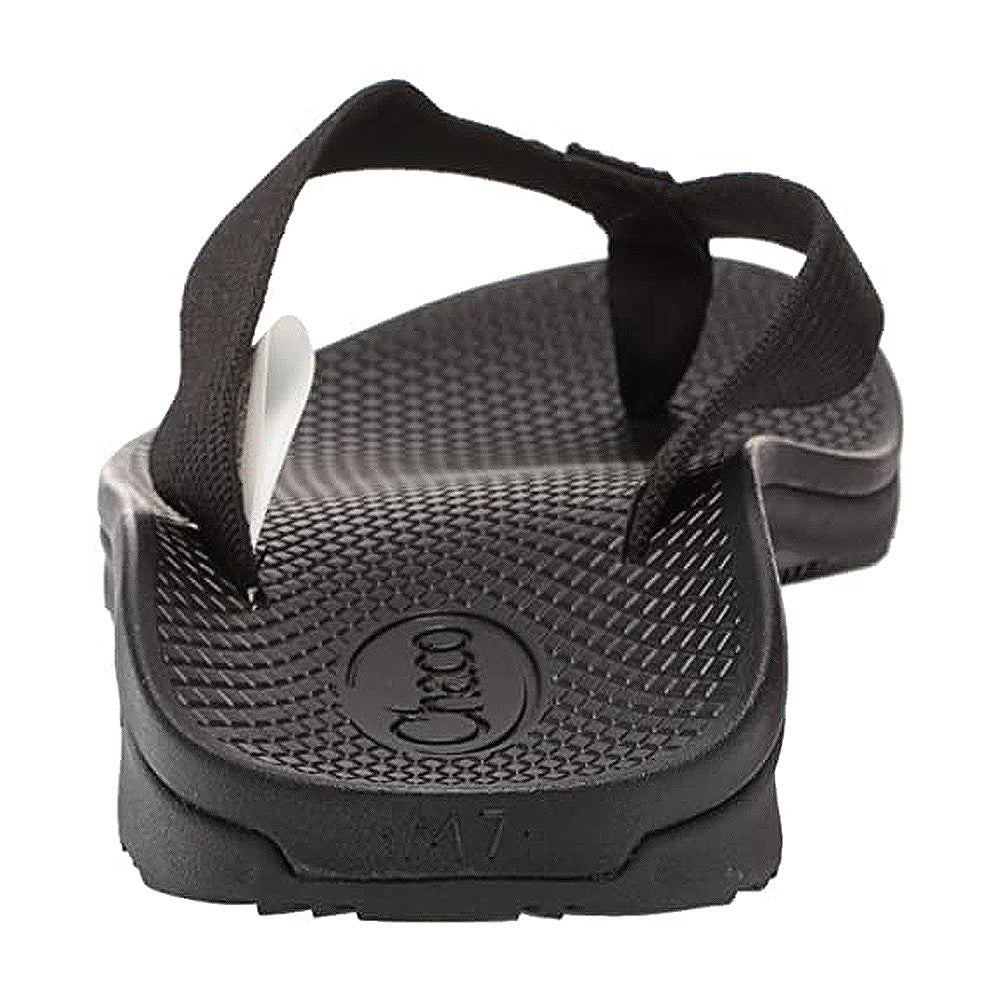 The Chaco Classic Flip - Men, shown from the back, features a textured footbed, fabric straps, a LUVSEAT PU midsole, and an embossed Chaco logo near the heel.