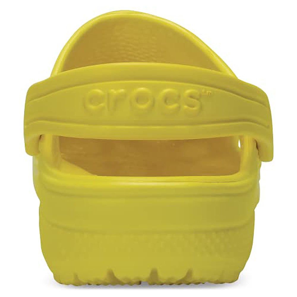 The Crocs Classic Clog - Kids in bright yellow, shown from the back with an embossed Crocs logo on the heel strap—perfect for kids everyday comfort.