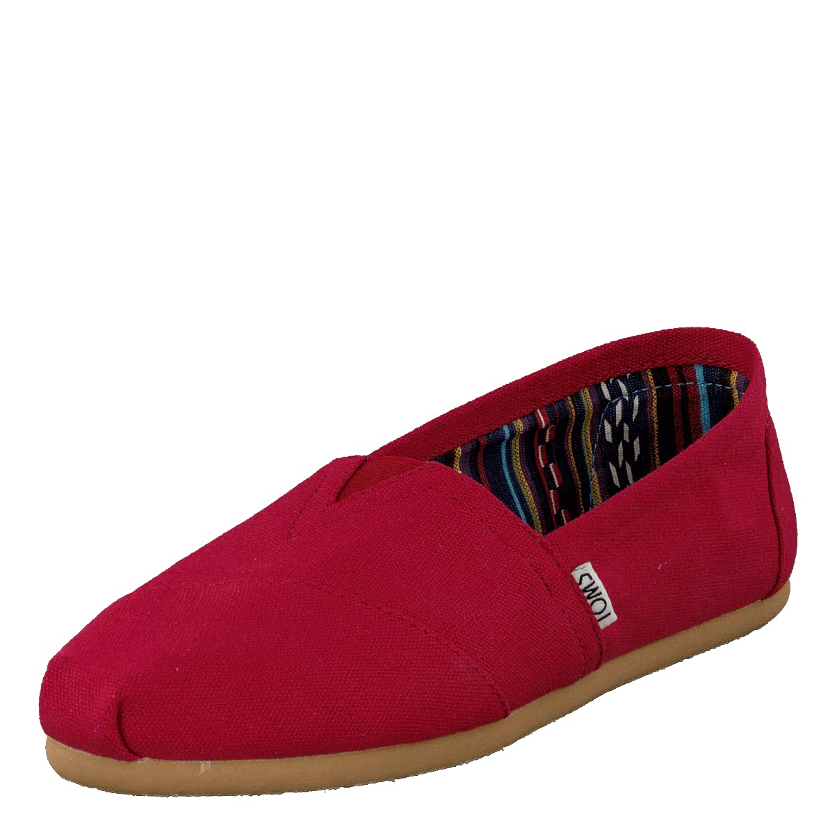 The TOMS Alpargata ESP - Women is a single red slip-on with a tan rubber sole, a multicolored patterned inner lining, and a small side fabric tag—reflecting TOMS signature buy one give one philosophy.
