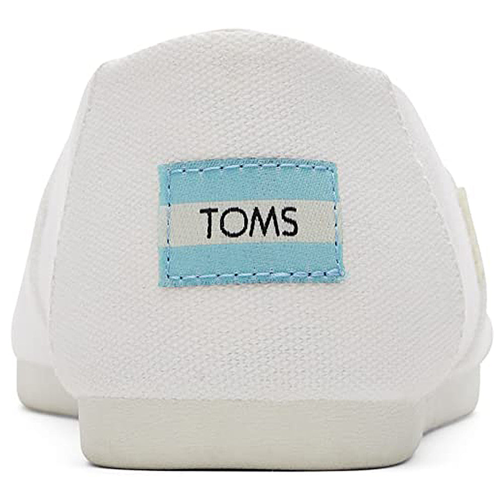 A close-up of the back of white TOMS Alpargata - Womens shoes shows a blue and white logo label on the heel, made from recycled cotton as part of the earthwise collection.