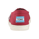 A red canvas TOMS Alpargata ESP - Women shoe with a white rubber sole, shown from the back. The heel displays a blue and white TOMS label, reflecting the brands buy one give one promise.