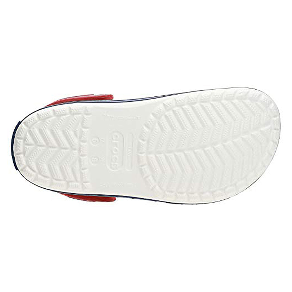 The image shows the undersole of the Crocs Crocband Clog Seasonal Colors - Unisex, featuring a herringbone tread, central Crocs branding, and stylish red and dark blue trim for practical everyday wear.