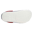 The image shows the undersole of the Crocs Crocband Clog Seasonal Colors - Unisex, featuring a herringbone tread, central Crocs branding, and stylish red and dark blue trim for practical everyday wear.