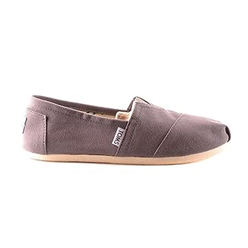 A single mens Classic Canvas TOMS slip-on in gray, featuring a tan rubber sole and a small white TOMS tag on the side.