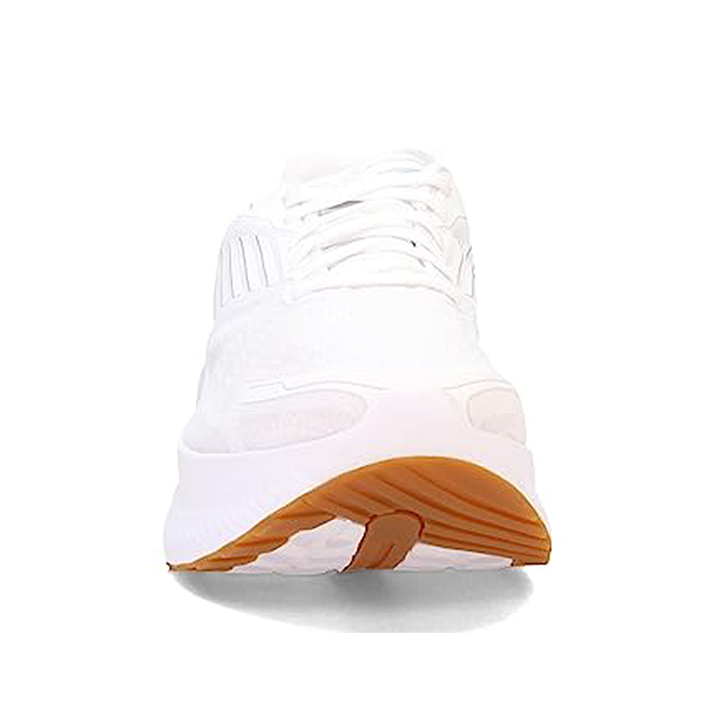 Front view of the mens Saucony Endorphin Shift 3 Running Shoe in white, featuring white laces, a thick PWRRUN foam sole, and a brown rubber outsole section, photographed on a plain white background.