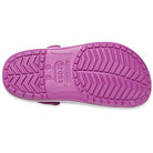 The image shows the sole of a pink Crocs Crocband Clog Seasonal Colors - Unisex sandal, with textured non-slip patterns and sizing info molded into the sole.