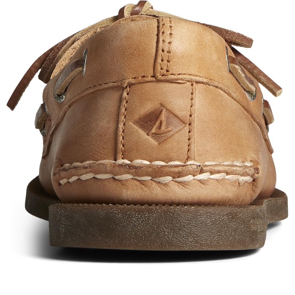 Close-up of the back of a brown Sperry A/O 2-EYE LEATHER mens boat shoe, showcasing visible stitching, a raised logo, and laces against a white background.