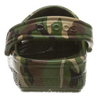 A close-up of the Crocs Classic Camo Clog - Unisex shows green, brown, and black camo print with a heel strap—versatile slip-on shoes from Crocs that are also comfortable water shoes.