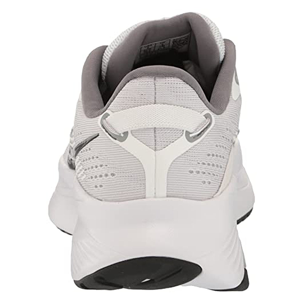 Rear view of the Saucony Guide 16 Running Shoe - Womens, a white sneaker with light gray accents, cushioned support, heel pull tab, black tread, and soft gray padded collar and lining for comfort.