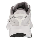 Rear view of the Saucony Guide 16 Running Shoe - Womens, a white sneaker with light gray accents, cushioned support, heel pull tab, black tread, and soft gray padded collar and lining for comfort.