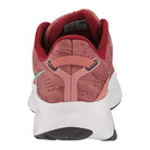 A rear view of the Saucony Guide 16 Running Shoe - Womens shows its pink and red textured upper, cushioned support, white midsole, black outsole, and a heel loop for easy on.