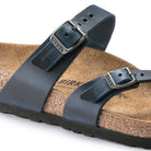 Close-up of the Birkenstock Mayari Oiled Leather sandal for women in navy blue, featuring adjustable metal buckles, oiled leather straps, a contoured cork footbed, and a black rubber sole. The Birkenstock logo appears on the buckle and footbed.