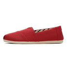 The TOMS Alpargata ESP - Women is a red canvas slip-on with a beige sole, shown from the side against a white background, showcasing the brands signature design.