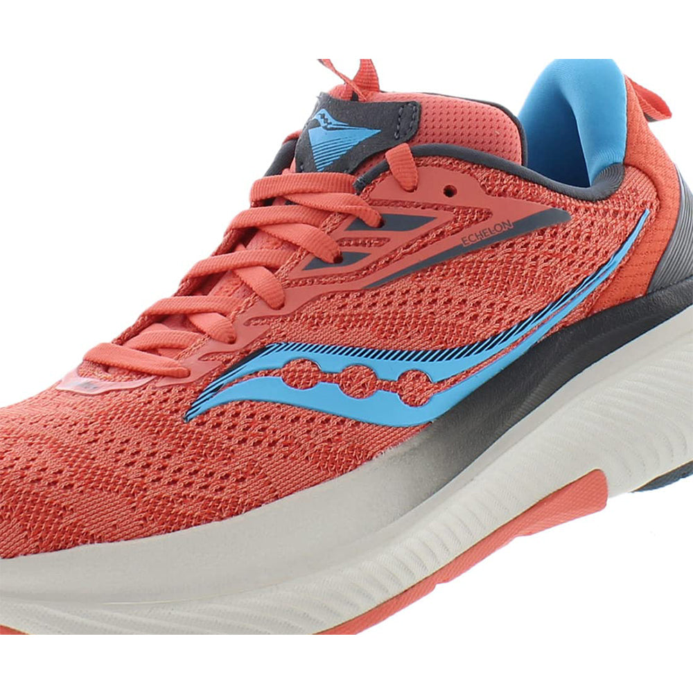 A close-up of the Saucony Echelon 9 Running Shoe - Womens in red with blue and black accents, seamless upper, thick white and gray sole, PWRRUN cushioning, and a bold blue Saucony logo on the side.
