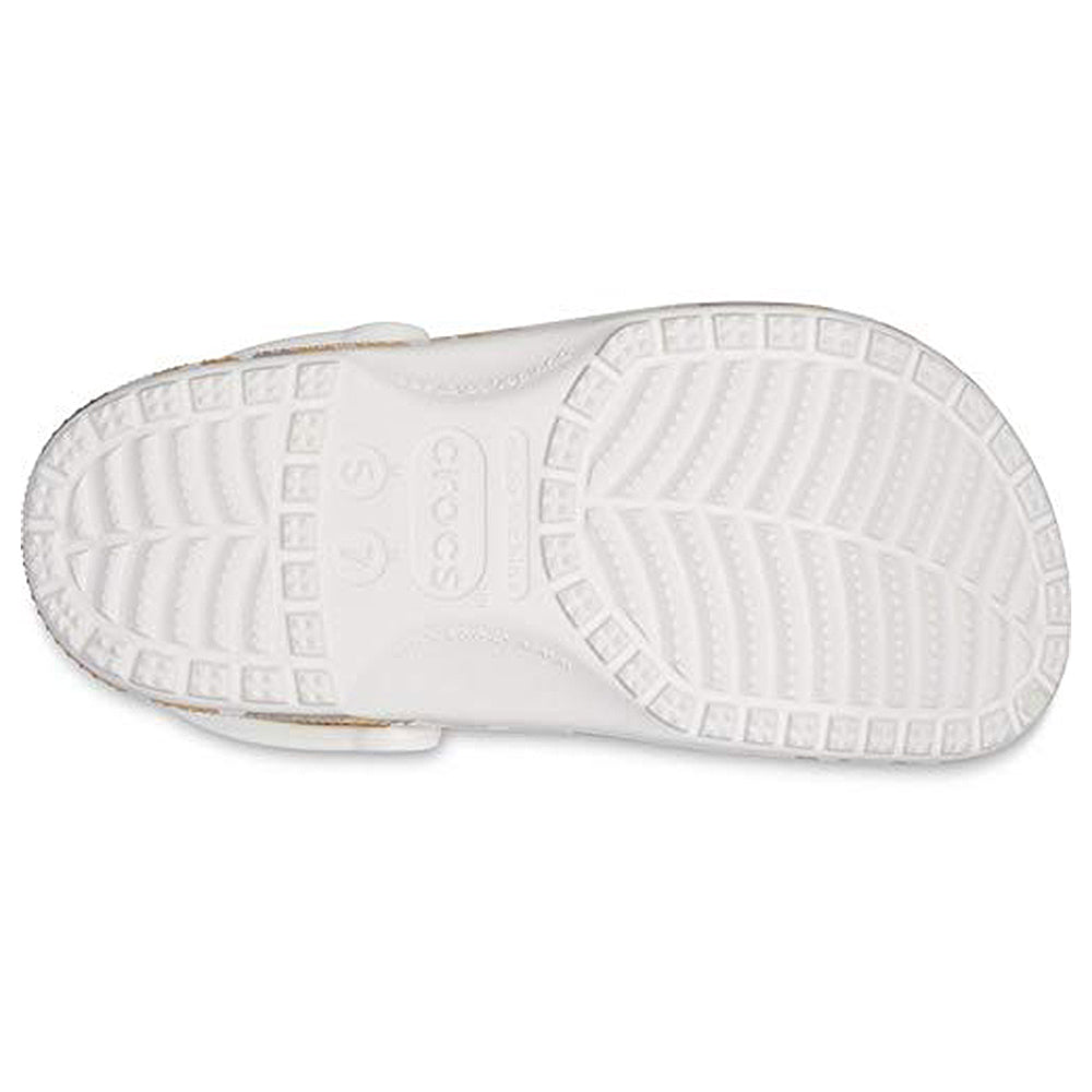 The image displays the white sole of the Crocs Classic Camo Clog - Unisex, shown from the bottom with distinct tread patterns and a central Crocs logo—perfect for anyone seeking comfortable unisex water shoes.