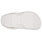The image displays the white sole of the Crocs Classic Camo Clog - Unisex, shown from the bottom with distinct tread patterns and a central Crocs logo—perfect for anyone seeking comfortable unisex water shoes.