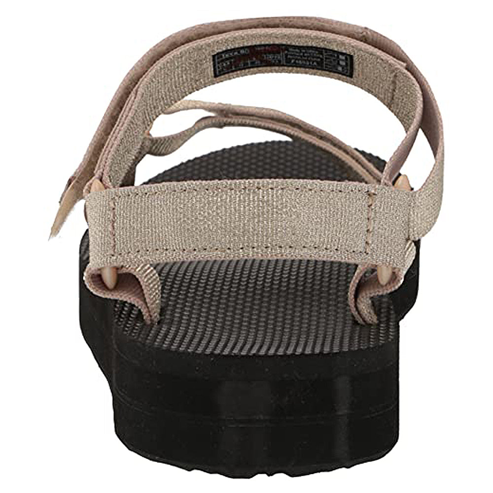 A close-up rear view of the Teva Midform Universal - Womens sandal in beige and black, showing a textured black sole and adjustable water-ready straps with hook-and-loop fasteners.
