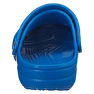 A rear close-up of the Crocs Classic Clog - Kids in blue, featuring a textured insole and adjustable heel strap, shown on a white background.