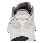 The Saucony Guide 16 - Womens sneaker is white, shown from the back with a gray lining, heel pull tab, textured details, and a thick cushioned white sole for comfort; the outsole features a black accent section.