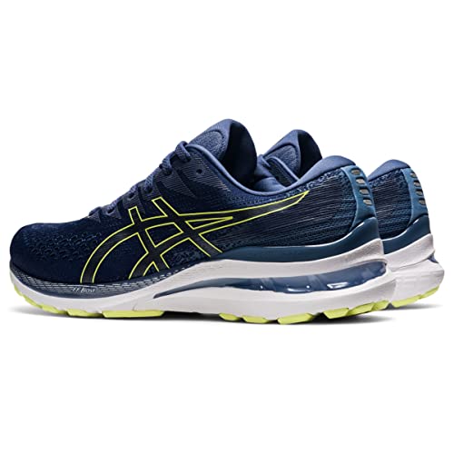 A pair of ASICS Gel Kayano 28 - Mens stability running shoes in navy blue with yellow accents and white midsoles, featuring GEL technology, a side logo, and textured outsoles are positioned side by side at an angle.