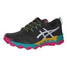 The ASICS GEL-FujiTrabuco 8 Womens sneaker features a black upper with a white logo, yellow and teal accents, patterned laces, a vibrant midsole, and a bright pink rugged outsole—perfect for trail running.