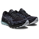 A pair of ASICS Gel Kayano 29 - Mens running shoes in black with white and silver accents, a patterned mesh upper, cushioned soles for stability, and the ASICS logo on the sides. The shoes are side by side, angled slightly forward.