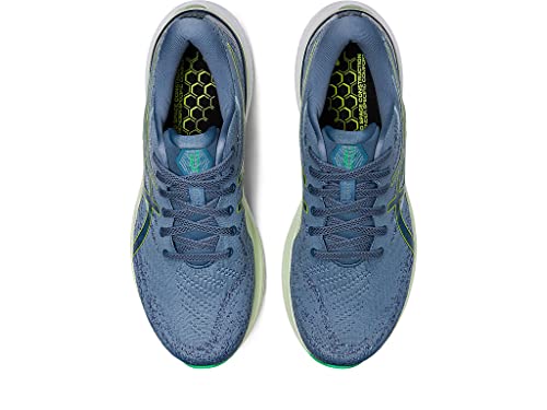 A pair of ASICS Gel Kayano 29 - Mens running shoes in blue, shown from above, feature mesh uppers, blue laces, and green hexagonal-pattern accents on the sides and insoles for added stability.