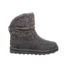 The BEARPAW Virginia Boots for women feature a gray wool knit shaft, textured fabric upper, faux fur lining, and a flat rubber sole. Shown from the side against a white background.