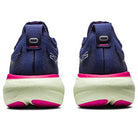 A pair of ASICS Gel Nimbus 25 - Womens Shoes in navy blue, seen from the back, with thick white soles and pink accents, breathable uppers, and lightweight cushioning ideal for running.