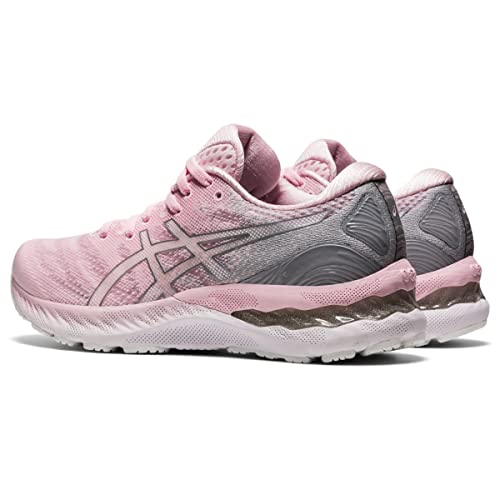 A pair of ASICS Gel Nimbus 23 Womens running shoes in pink and gray with white soles, mesh upper, cushioned heel, shock absorption, pink laces, and the ASICS logo on the side.