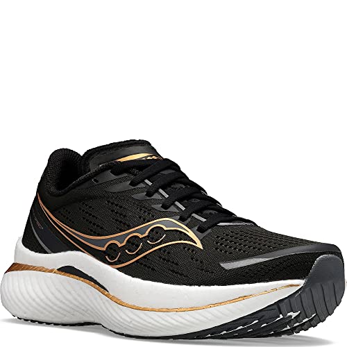 The Saucony Endorphin Speed 3 Running Shoe for women features a black design with gold and gray accents, a thick textured white sole, and black laces—ideal for daily training and athletic activities.