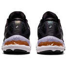 Rear view of ASICS Gel Nimbus 23 - Womens shoes in black with white and orange accents, highlighting the heel, sole, and ASICS logo—celebrated for their exceptional shock absorption.