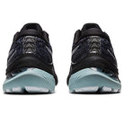 A rear view of the ASICS Gel Kayano 29 - Mens running shoes in black and teal, featuring textured uppers, transparent heel cushioning for stability, and light blue outsoles.