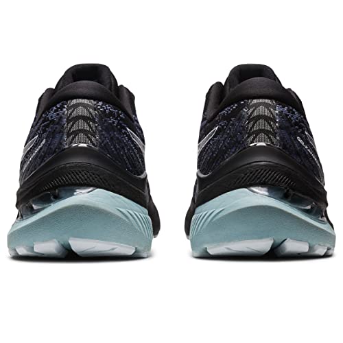 A rear view of the ASICS Gel Kayano 29 - Mens running shoes in black and teal, featuring textured uppers, transparent heel cushioning for stability, and light blue outsoles.