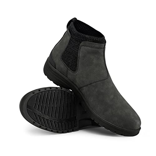 A pair of Hey Dude Scott Grip Boots for men in dark gray, featuring black elastic side panels and black rubber soles; one boot stands upright, while the other shows the ultra-grip tread pattern on the outsole.