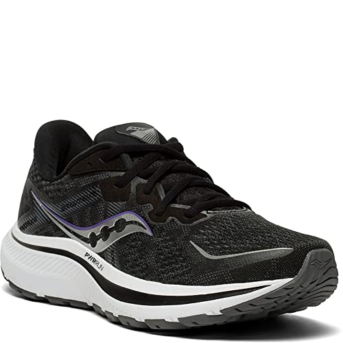 The Saucony Omni 20 Running Shoe - Womens is a black running shoe with white and gray accents, designed for stability and support. It features a thick white sole, black laces, and the Saucony logo on the side, shown from the front and outer angle.